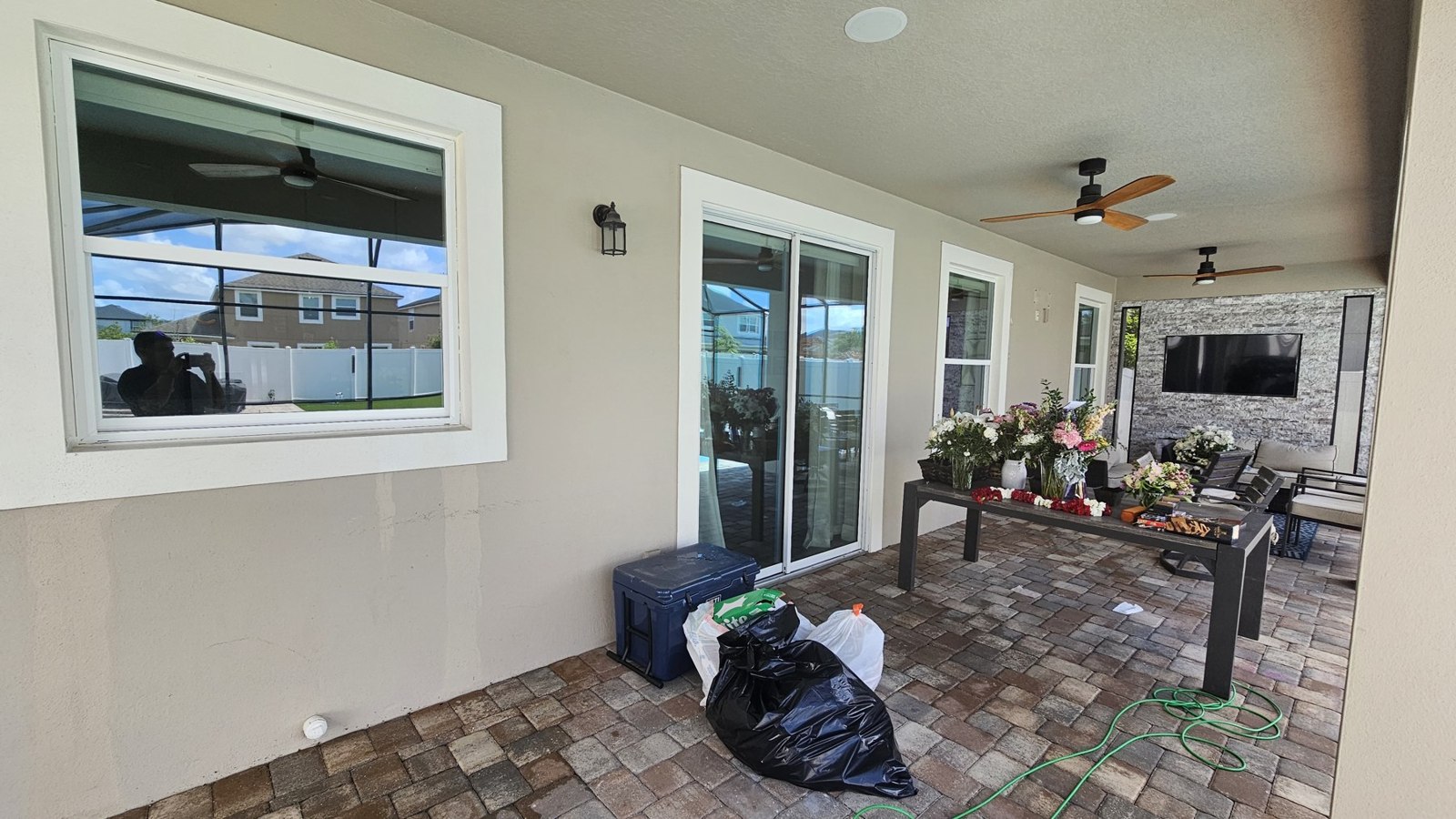 Porch Window Cleaning in Saint Cloud, FL: covered porch with windows and sliding glass doors